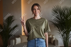 Woman wearing olive green t shirt and jeans image Product Image 1