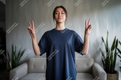 Woman peaceful gesture dark blue shirt image Product Image 1