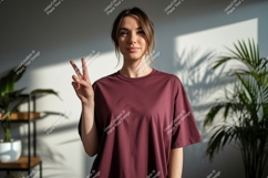 Woman wearing maroon t-shirt showing peace sign image Product Image 1