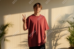 Young man wearing maroon t-shirt peace sign Product Image 1