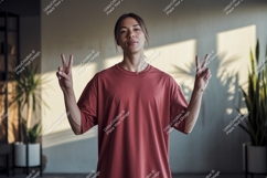 Person wearing red t shirt making peace sign male Product Image 1