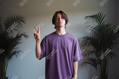 Man wearing purple t shirt making peace sign t-shirt Product Image 1