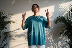 Woman wearing teal t shirt peace sign image Product Image 1