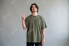 Man wearing olive green t shirt showing peace sign Product Image 1