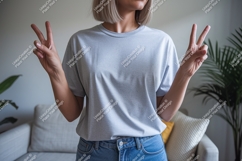 Woman wearing grey t shirt and blue jeans image Product Image 1