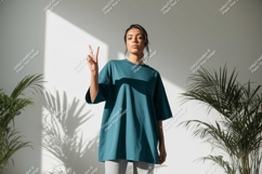 Teal t shirt mockup with peace sign woman Product Image 1