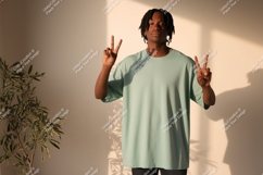 Man wearing light green t shirt peace sign t-shirt Product Image 1
