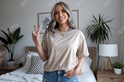 Woman wearing beige t-shirt and jeans peace Product Image 1