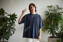 Young man peace sign dark blue shirt image Product Image 1