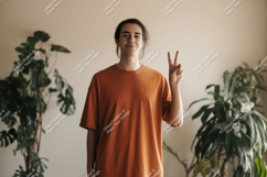 Young man peace sign orange shirt image Product Image 1