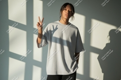 Young woman grey t shirt peace sign image Product Image 1