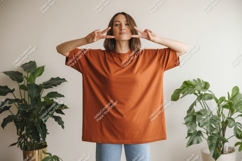 Woman wearing orange t shirt peace sign image Product Image 1
