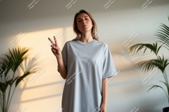 Woman peace sign light blue shirt image Product Image 1