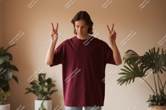 Young man showing peace sign male t-shirt Product Image 1