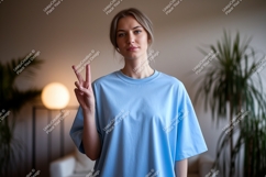Woman peace sign light blue shirt image Product Image 1