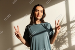 Woman wearing blue shirt making peace sign image Product Image 1