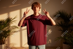 Young man wearing maroon t-shirt peace sign image Product Image 1