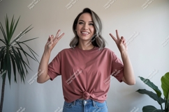 Woman wearing pink t shirt and jeans image Product Image 1