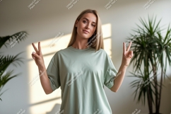 Woman peace sign gesture light green t shirt image Product Image 1