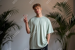 Man wearing light green t-shirt casual peace Product Image 1