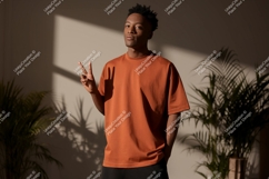 Man orange shirt peace sign indoor image Product Image 1