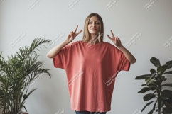 Woman wearing coral t shirt peace sign image Product Image 1