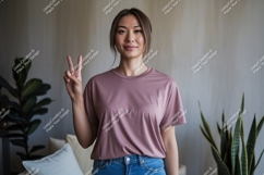 Woman wearing pink t shirt peace sign image Product Image 1