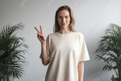 Woman peace sign cream shirt plants image Product Image 1