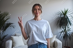 Woman wearing light grey t shirt and jeans image Product Image 1