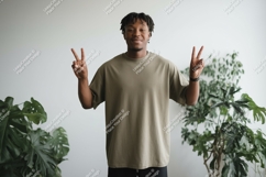 Man wearing olive t shirt peace sign t-shirt Product Image 1