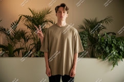 Man wearing tan t shirt peace sign image Product Image 1
