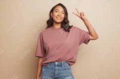 Woman wearing pink t shirt and jeans image Product Image 1