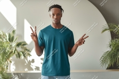Man wearing teal t shirt peace sign t-shirt Product Image 1