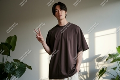 Man wearing brown t shirt peace sign image Product Image 1