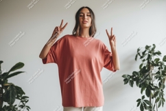 Woman wearing salmon t shirt peace sign image Product Image 1
