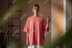 Woman wearing coral oversized t shirt image Product Image 1