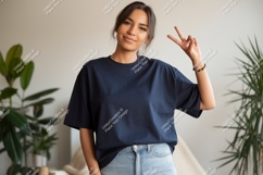 Woman wearing dark blue t shirt and jeans image Product Image 1