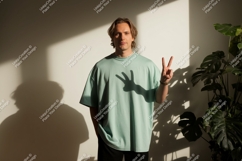 Man wearing mint green t shirt peace sign image Product Image 1