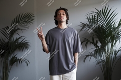 Man wearing grey t-shirt and white pants Product Image 1
