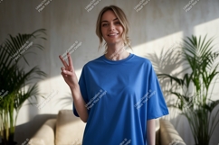 Woman wearing blue t shirt peace sign t-shirt Product Image 1