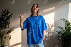 Young woman peace sign blue shirt image Product Image 1