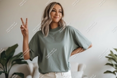 Woman wearing green t shirt peace sign image Product Image 1