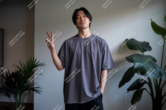 Man wearing grey t-shirt with peace sign Product Image 1
