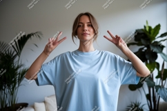 Young woman peace sign light blue shirt image Product Image 1