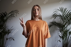 Woman orange t shirt peace sign plants image Product Image 1