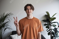 Young man peace sign gesture casual Product Image 1