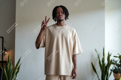 Man wearing beige t shirt and shorts peace sign t-shirt Product Image 1