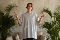 Young woman grey t shirt peace sign image Product Image 1