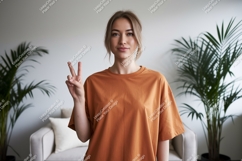 Woman peace sign orange shirt image Product Image 1