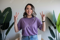 Woman wearing purple t shirt peace sign image Product Image 1